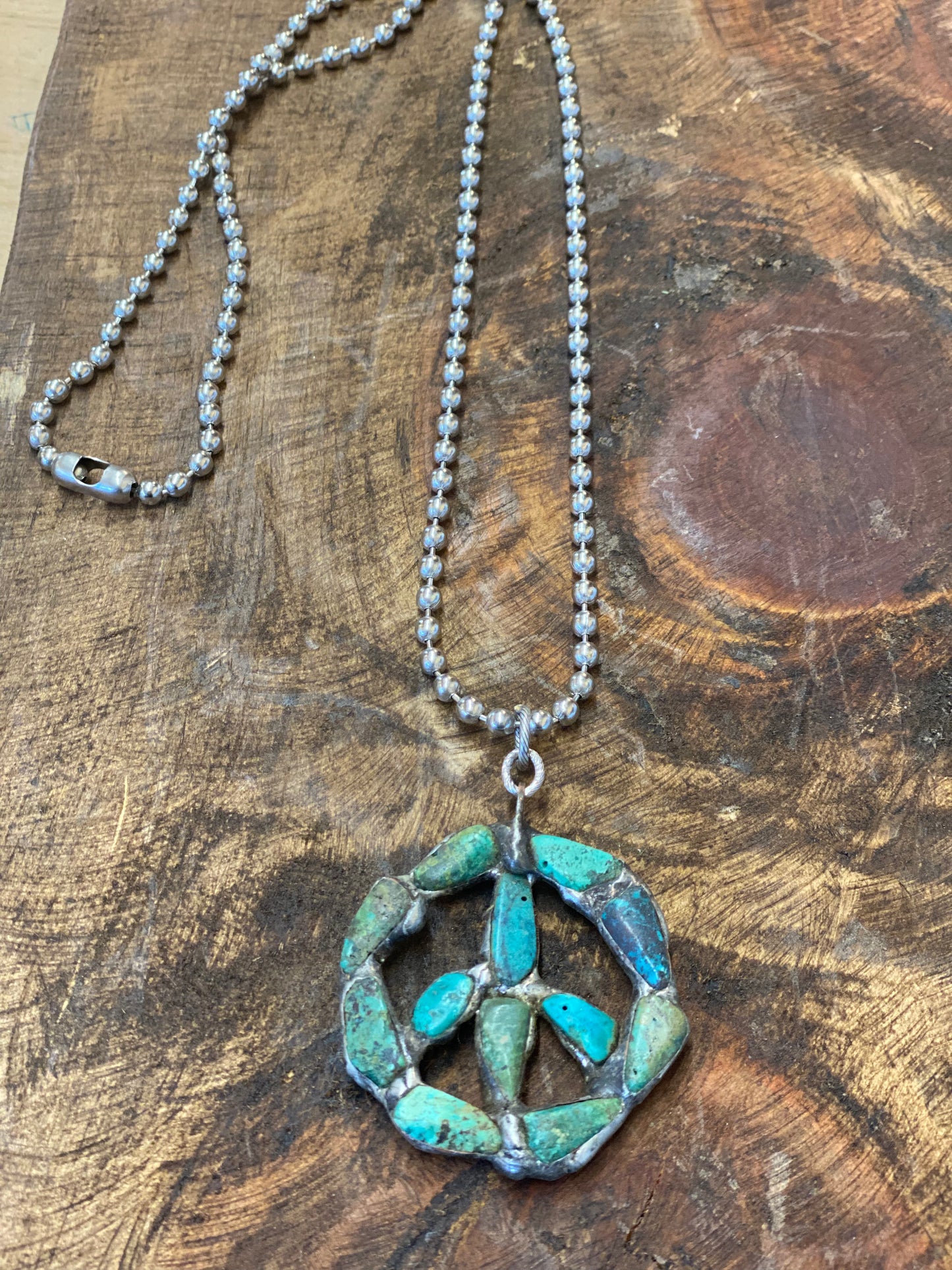 Small peace sign genuine turquoise neck
