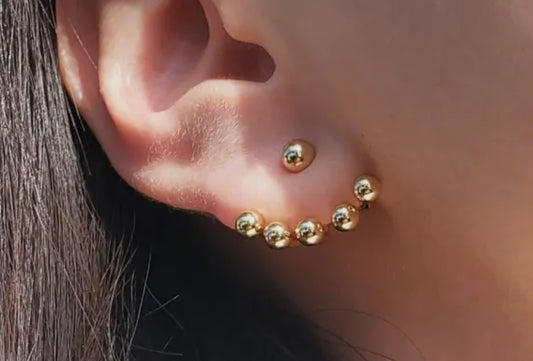 Gold dote stud earrings