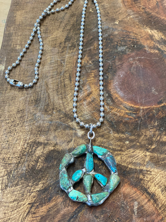 Small peace  sign genuine turquoise neck