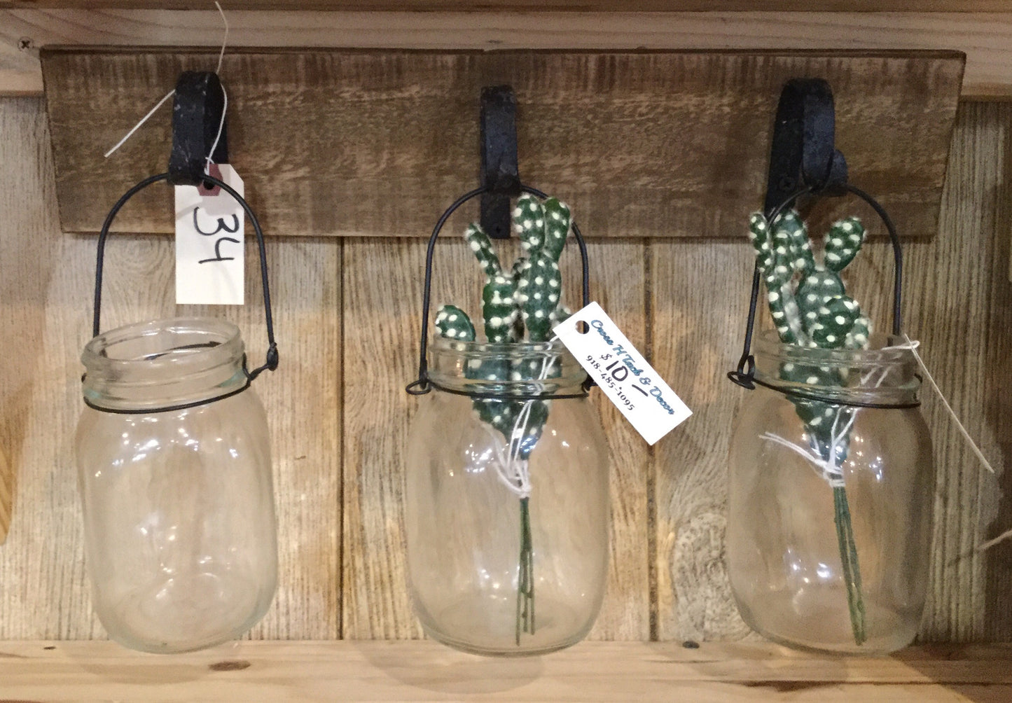 Three Canning Jars Hanging on Wood